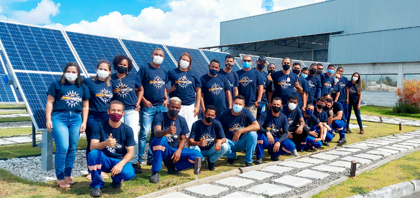 A team with shine together shirts on pose for a photo with mask on